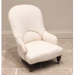 A Victorian upholstered low seat nursing chair, in lattice pattern ivory coloured fabric, the arched