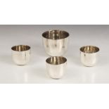 A silver tumbler cup and three spirit measures, William Comyns & Sons Ltd, London 1968, each of