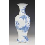 A Chinese porcelain blue and white baluster base, Kangxi style, decorated with figures in a garden