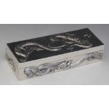 A Chinese silver trinket box, possibly Po Cheng, of rectangular form, chased in relief with dragons,