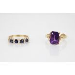 An Amethyst and diamond ring, the central rectangular step cut amethyst measuring 11.5mm x 8mm, claw