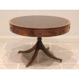 A Regency style mahogany library drum table, late 20th century, the gilt tooled inset skiver above