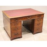 A Victorian mahogany twin-pedestal desk, the rectangular moulded top with a later inset skiver