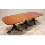 A Regency style mahogany triple pillar dining table, early 20th century, possibly by Maple & Co, the