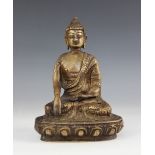 A South East Asian bronze buddha, 20th century, seated in the Bhumisparsha Mudra position, upon a