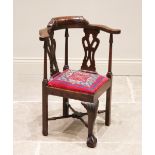 A Chippendale revival child's mahogany corner chair, late 19th/early 20th century, the curved top