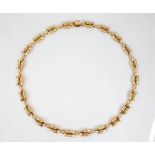 A continental 18ct gold necklace, designed as cast floral lozenge shaped links with beaded detail,