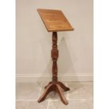 An oak and beech wood lectern, late 20th century, the sloping book rest raised upon a block and