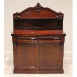 A Victorian mahogany chiffonier, of cottage proportions, the shaped raised back applied with moulded