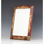 A Chinese Canton lacquered dressing table mirror, of rectangular form, the gilt highlighted red