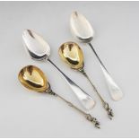 A pair of Victorian silver gilt apostle serving spoons, Henry Holland, London 1863, each with fig