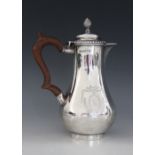 A Victorian silver hot water jug, Lowe & Sons, Chester 1880, of baluster form on circular foot