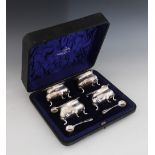 A Edwardian cased set of four silver salts, Edward Souter Barnsley (one mark unclear), Birmingham