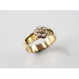 A 19th century pearl set memorial ring, designed as a floral cluster set with half pearls, set