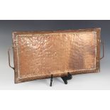 An Arts & Crafts copper tray by John Pearson, later 19th/early 20th century, of rectangular form