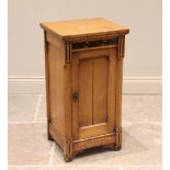 A late 19th century ash Aesthetic Movement pot cupboard, the rectangular top with a simulated dentil