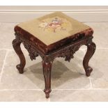 A William IV mahogany dressing stool, the square tapestry seat raised upon leaf carved cabriole legs