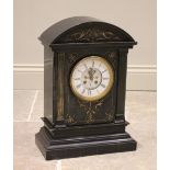 A large Victorian slate mantel clock, the arched architectural case with fluted pilasters flanking