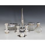 A selection of silver mounted and silver coloured tableware, to include a silver mounted capstan