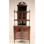 A late 19th century rosewood and inlaid free-standing corner display cabinet, with open work