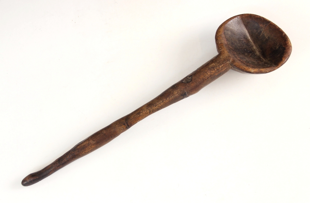 A Welsh carved spoon or Lledwad, probably fruitwood, late 19th/early 20th century, of typical form