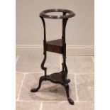 A George III mahogany wig/wash stand, the moulded circular collar above a triangular tier with a