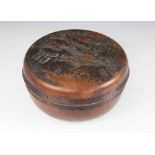 A Chinese carved wood box and cover, circa 1910, the box of circular form with removable cover,