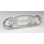 An Edwardian silver hair pin tray, Deakin & Francis Ltd, Birmingham 1901, of elongated oval form