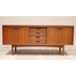 A mid 20th century 'Long John' style teak sideboard, the four central tambour effect drawers flanked