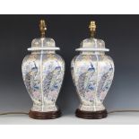 A pair of Japanese export lamp bases, 20th century, modelled as temple vases and covers of