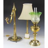 A Victorian brass oil lamp, of typical form, reservoir upon a knopped column and circular base, with
