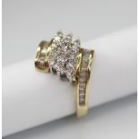 A diamond set 9ct gold cluster ring, the principle round brilliant cut diamond weighing