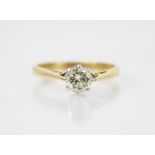 A diamond solitaire ring, the central round brilliant cut diamond weighing approximately 0.65