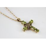 A peridot and seed pearl 9ct Celtic cross pendant, comprising five oval mixed cut peridots to a seed