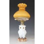 A Staffordshire porcelain oil lamp modelled as a white owl, 19th century, the body forming the