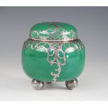 A continental porcelain and silver plated overlaid tea caddy, modelled as a squat ginger jar with