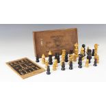 A John Calvert style pale wood and ebonised chess set, the kings 7.5cm high (one at fault), to an
