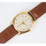 A gentleman's 9ct gold vintage Omega wristwatch, the circular cream dial with Arabic numerals, set