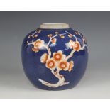 A Chinese porcelain powder blue ginger jar, 19th century, of ovoid form and decorated in iron-red