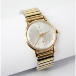 A gentleman's vintage 9ct gold Majex wristwatch, the circular silvered dial with Arabic numerals