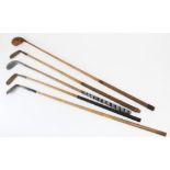 Five late 19th /early 20th century golf clubs to include an A H Scott 'Elie' driver, 113cm long,