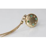 A 9ct gold turquoise and simulated pearl set locket pendant, of circular form, the cover set with