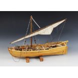 A Whitby Shipwrights model of an armed cutter, the wooden ribbed and planked hull mounted with metal