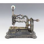 An American Charles Raymond ‘Globe’ type sewing machine, circa 1880, raised upon an integrated