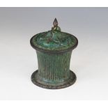 A Victorian painted metal jar and cover, the tapering reeded body on cast circular foot, the cover