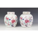 A pair of Chinese porcelain famille rose ginger jars and covers, 19th century, each of globular form