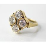 A diamond four-stone ring, comprising four round old cut diamonds, measuring approximately: 6.58mm x