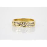 An 18ct gold diamond crossover ring, the designed as two rows of single cut diamonds, channel set in