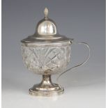 A Dutch cut glass silver mounted wet mustard, the circular body with hobnail detail, raised on
