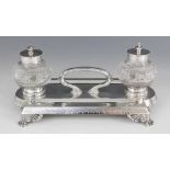 A Victorian silver and cut glass desk stand, Horace Woodward & Co, Birmingham 1879, the shaped